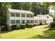 Charming two-story home with blue shutters, freshly mowed lawn, and mature landscaping at 5322 Seaton Dr, Atlanta, GA 30338