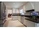 Modern kitchen with stainless steel appliances, granite countertops, and ample cabinet space at 5322 Seaton Dr, Atlanta, GA 30338