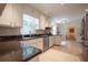 Bright kitchen featuring white cabinets, granite countertops, stainless appliances, and tile flooring at 5322 Seaton Dr, Atlanta, GA 30338
