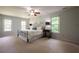 Spacious main bedroom with natural light showcases a decorative ceiling fan and comforting color scheme at 5322 Seaton Dr, Atlanta, GA 30338