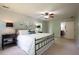 Serene main bedroom has ensuite bathroom, a decorative ceiling fan, and comforting color scheme at 5322 Seaton Dr, Atlanta, GA 30338