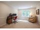 This home office has a large window for natural light and space for comfort and productivity at 5322 Seaton Dr, Atlanta, GA 30338