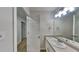 Neutral bathroom with a white door, light fixture, sink, and mirror above it at 700 Patriots Point St, Locust Grove, GA 30248