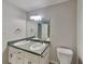 Bathroom with double vanity sinks, modern fixtures, and a toilet at 700 Patriots Point St, Locust Grove, GA 30248