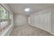 Neutral bedroom with a window and a spacious closet at 700 Patriots Point St, Locust Grove, GA 30248