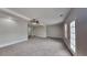 Spacious bedroom with carpet flooring and a french door to the backyard at 700 Patriots Point St, Locust Grove, GA 30248