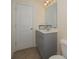 Cozy bathroom featuring a gray vanity, light countertop, and wood-look flooring at 126 Oakleigh Pointe Dr, Dallas, GA 30157
