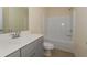 Bathroom with shower-tub combo, gray vanity and modern sink at 126 Oakleigh Pointe Dr, Dallas, GA 30157