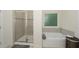 Bathroom featuring a glass shower and soaking tub at 126 Oakleigh Pointe Dr, Dallas, GA 30157