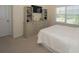 Well-lit bedroom with a dresser, a flat-screen TV, and a comfortable bed at 126 Oakleigh Pointe Dr, Dallas, GA 30157