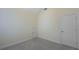 This bedroom features neutral walls, carpet flooring, and a spacious closet at 126 Oakleigh Pointe Dr, Dallas, GA 30157