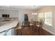 Charming breakfast area with counter and stools, a glass table and a view to the backyard at 126 Oakleigh Pointe Dr, Dallas, GA 30157