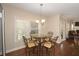 Bright breakfast nook with a glass-top table and seating for four, illuminated by a pendant light at 126 Oakleigh Pointe Dr, Dallas, GA 30157