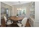 Dining room featuring hardwood floors, wainscoting, and a round wooden table at 126 Oakleigh Pointe Dr, Dallas, GA 30157