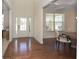 Dining room featuring hardwood floors, wainscoting, and a modern light fixture at 126 Oakleigh Pointe Dr, Dallas, GA 30157