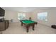 Spacious recreational room with pool table, television, and natural light at 126 Oakleigh Pointe Dr, Dallas, GA 30157