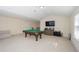 Large recreational room with pool table, television, and natural light at 126 Oakleigh Pointe Dr, Dallas, GA 30157