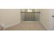 Second-floor hallway featuring carpet, white doors, trim and decorative railing at 126 Oakleigh Pointe Dr, Dallas, GA 30157
