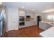 Modern kitchen with stainless steel appliances, double ovens, gray cabinets, and granite countertops at 126 Oakleigh Pointe Dr, Dallas, GA 30157