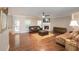 Inviting living room with hardwood floors, fireplace, ceiling fan, and comfortable leather seating at 126 Oakleigh Pointe Dr, Dallas, GA 30157