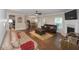 Expansive living area featuring hardwood floors, a fireplace, and seamless flow to dining at 126 Oakleigh Pointe Dr, Dallas, GA 30157