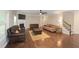 Spacious living room with hardwood floors, a fireplace, and comfortable seating arrangements at 126 Oakleigh Pointe Dr, Dallas, GA 30157