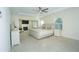Spacious main bedroom with a tray ceiling, fireplace, sitting area, and bright windows at 126 Oakleigh Pointe Dr, Dallas, GA 30157
