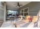 Covered patio with a lounge bed, ceiling fan, outdoor seating, and barbecue grill at 126 Oakleigh Pointe Dr, Dallas, GA 30157