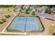 Aerial view of community tennis courts with surrounding homes and green spaces offering recreational opportunities at 126 Oakleigh Pointe Dr, Dallas, GA 30157