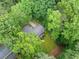 Aerial view showcasing home's deck and the beautiful mature landscaping and backyard at 1260 Willeo Creek Dr, Roswell, GA 30075