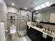 A newly renovated bathroom offers a glass shower, dual vanity, and modern fixtures at 1260 Willeo Creek Dr, Roswell, GA 30075