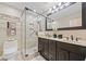 Updated bathroom features a glass enclosed shower, double sink vanity, and neutral color palette at 1260 Willeo Creek Dr, Roswell, GA 30075