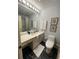 A full bathroom is complete with a vanity and a shower-tub combo at 1260 Willeo Creek Dr, Roswell, GA 30075