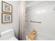 Cozy bathroom with a shower-tub combo, neutral color palette, and framed art at 1260 Willeo Creek Dr, Roswell, GA 30075