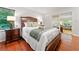 Cozy bedroom boasts hardwood floors, a large bed, and sliding glass doors at 1260 Willeo Creek Dr, Roswell, GA 30075