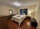 Cozy bedroom with wood floors and neutral tones offering a calming retreat at 1260 Willeo Creek Dr, Roswell, GA 30075