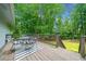 Relaxing deck with outdoor seating perfect for enjoying the serene wooded surroundings at 1260 Willeo Creek Dr, Roswell, GA 30075