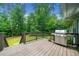Spacious outdoor deck with a stainless steel grill, ideal for barbecues and entertaining at 1260 Willeo Creek Dr, Roswell, GA 30075