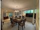 Formal dining room with chandelier lighting, view into the living area, and natural light at 1260 Willeo Creek Dr, Roswell, GA 30075