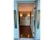 Inviting entryway with wood floors and decorative sconces providing a warm welcome at 1260 Willeo Creek Dr, Roswell, GA 30075