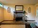 Classic stone fireplace with decorative accents in a well-lit living space at 1260 Willeo Creek Dr, Roswell, GA 30075