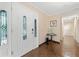Spacious foyer with hardwood floors, decorative doors, and closet space at 1260 Willeo Creek Dr, Roswell, GA 30075
