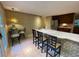 An eat-in kitchen features seating at the island and a decorative pendant light at 1260 Willeo Creek Dr, Roswell, GA 30075