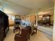 Open floor plan combining living and dining areas, highlighted by a stone fireplace and a chandelier at 1260 Willeo Creek Dr, Roswell, GA 30075