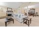 Cozy living room with stone fireplace and open floor plan to dining area at 1260 Willeo Creek Dr, Roswell, GA 30075