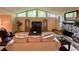 Spacious living room with stone fireplace, large windows, and comfortable seating at 1260 Willeo Creek Dr, Roswell, GA 30075