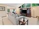 Bright living room with large windows, a built-in entertainment center and neutral tones at 1260 Willeo Creek Dr, Roswell, GA 30075