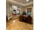 Office with hardwood floors, French doors leading to bedroom, and wooden desk at 1260 Willeo Creek Dr, Roswell, GA 30075
