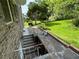 View of the backyard with a brick patio and steps to the basement at 3662 Greentree Farms Dr, Decatur, GA 30034