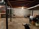 Unfinished basement featuring exposed ceiling, concrete floor, and cinderblock walls, offering potential for customization at 3662 Greentree Farms Dr, Decatur, GA 30034